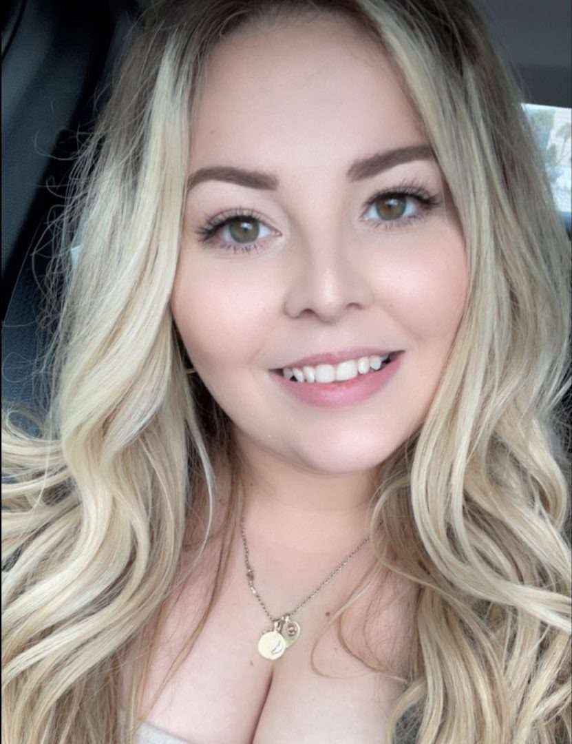 Bethany Delisle, owner and stylist at Beauty Boss Hair Studio, with long blonde hair