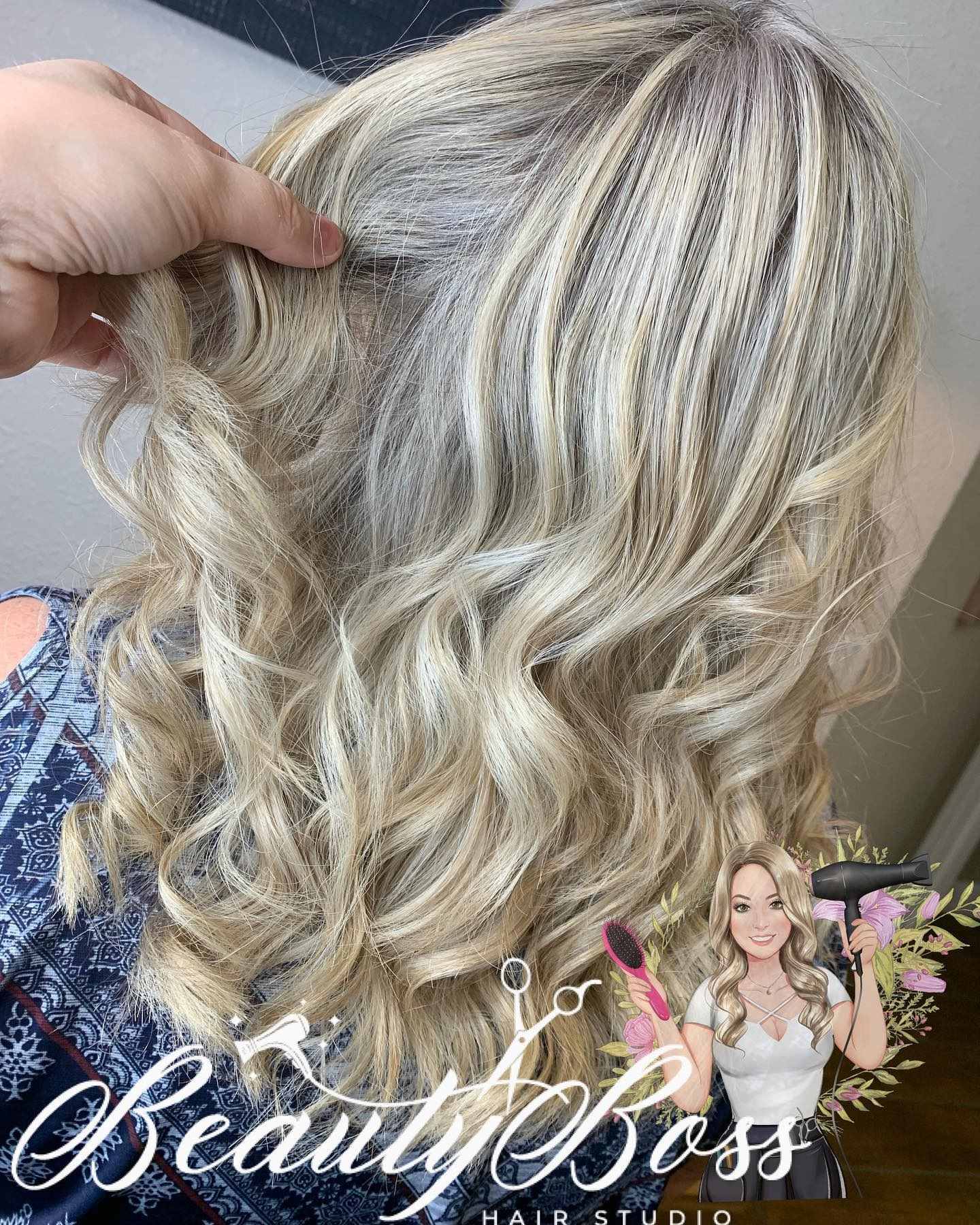 Creamy blonde highlights on shoulder-length curls