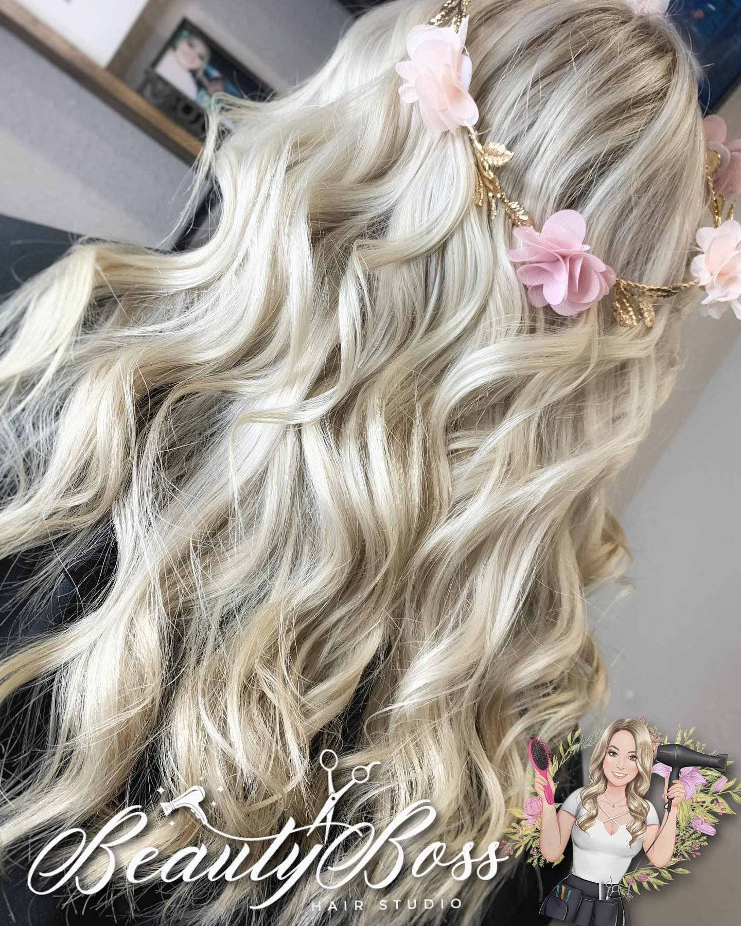 Long platinum blonde hair styled in loose waves with a pink flower crown