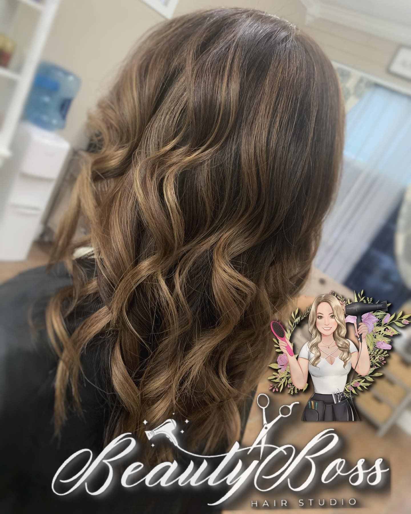 Soft caramel balayage painted through brunette curls