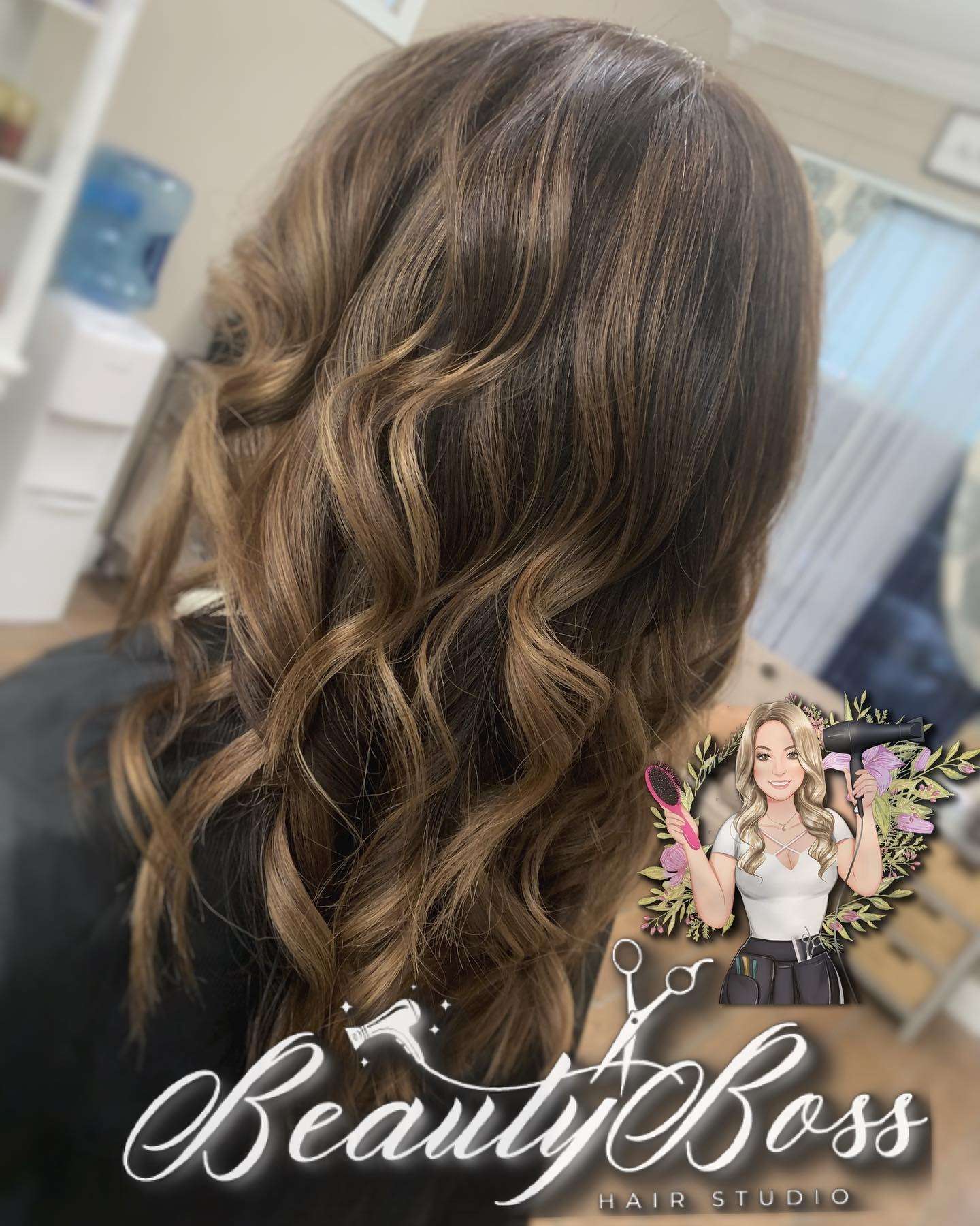 Soft caramel balayage painted through brunette curls
