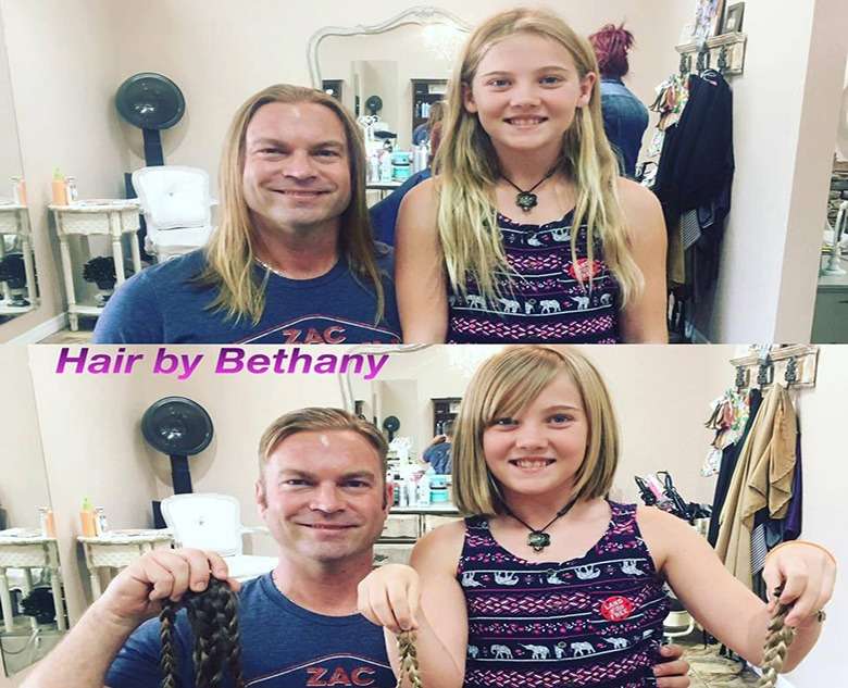 Two clients holding their long ponytails after donation haircuts, captioned Hair by Bethany